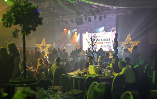 Lincolnshire Buisness Awards held at the Engine Shed, Lincoln in may 2022. The venue is filled with people and fizzcos decorations.